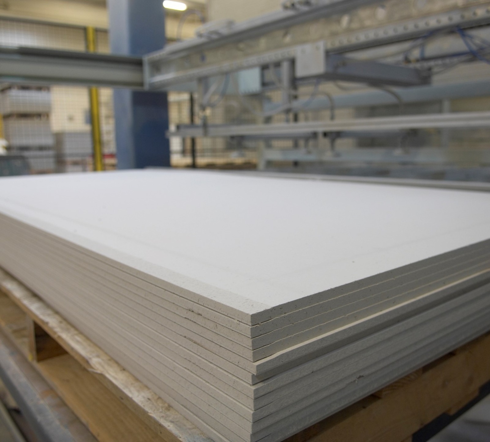 Stacked building boards in factory
